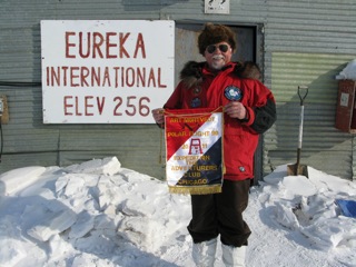 Art at the Eureka Weather Station with the fine hand made flag presented to Art by the Adventurers Club of Chicago.