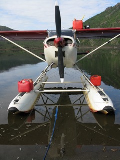 Refueling the Cessna 180 float plane at Lake Minakokosa