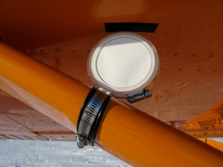 Microbial air filters for Dr. Sattler mounted on wing strut of the Polar Pumpkin. A new version utilizes modified butter dish technology.