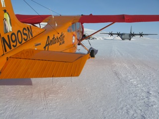 The Polar Pumpkin and a Canadian Forces Hercules C-130 parked on the Eureka airport ramp.