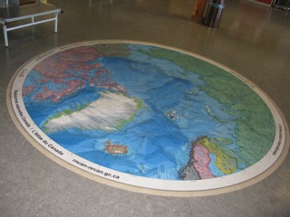 The Inuvik airport terminal building is a modern - very clean - well kept facility. In the middle of the lobby floor there is a map of the Circumpolar North.